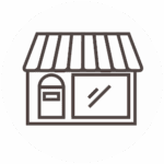 Simple black and white line drawing of a small storefront with a door and a large front window, shown within a circular border.